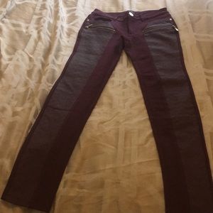 Wine colored pants with pleather detail.